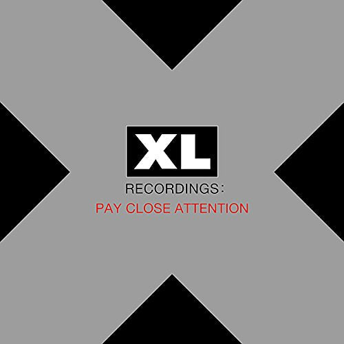 CD cover for "Xl Recordings - Pay Close Attention" with black and gray design.