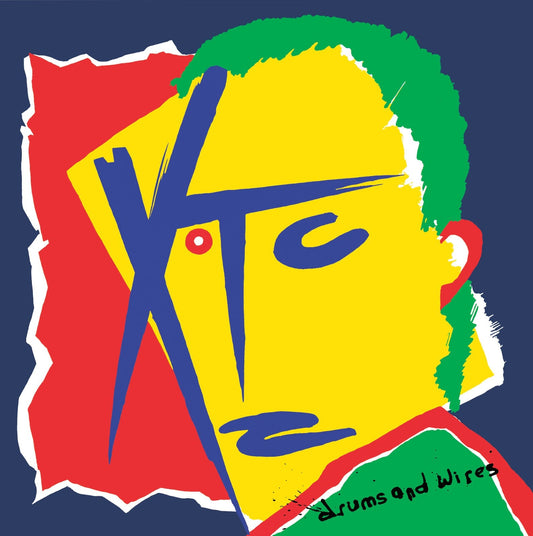 XTC album cover: abstract yellow face with green hair and red accents.