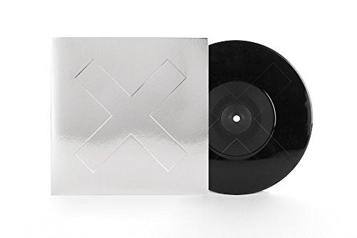 Silver square record sleeve with an embossed X next to a black vinyl disc.