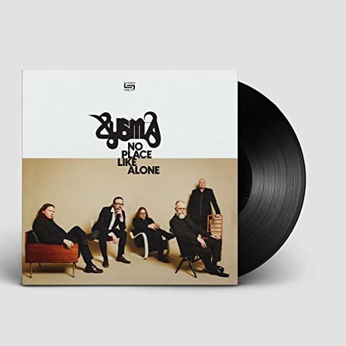 Vinyl record and album cover featuring a band in dark clothing.