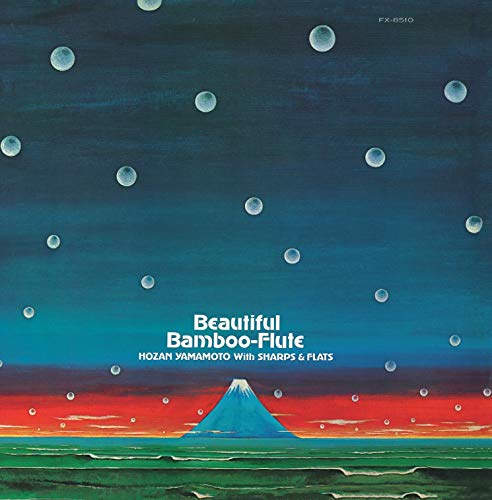 "Album cover featuring a serene mountain landscape under a starry night sky."