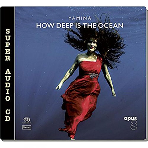 CD cover: woman in red dress underwater, flowing hair.