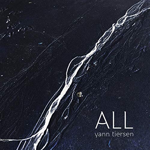 Album cover showing a white stream of water flowing across dark, textured ground.