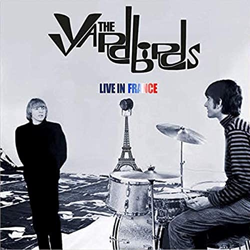 Yardbirds album cover with musicians, Eiffel Tower, and drum set.
