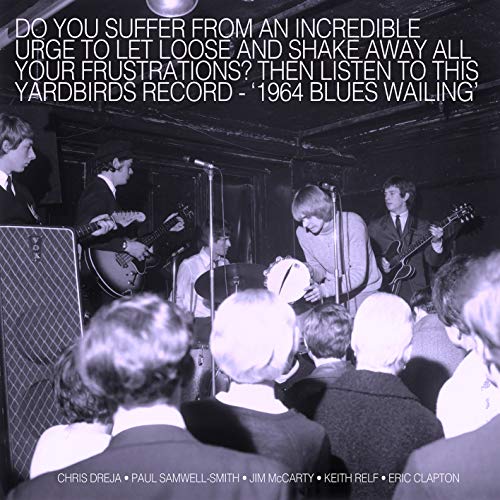 Black and white image of the Yardbirds band performing on stage to an audience.