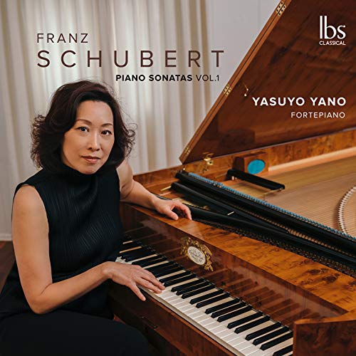 Pianist Yasuyo Yano sits at a grand piano, album cover for Schubert sonatas.