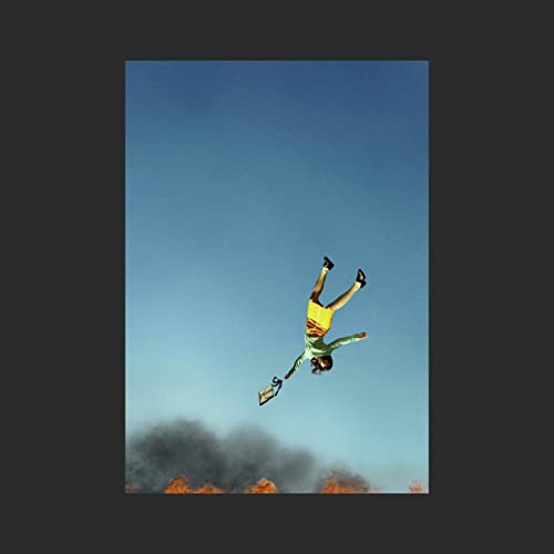Album cover: person falling against a bright blue sky.