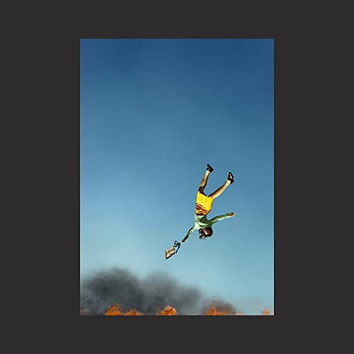 Album cover: person falling against a blue sky with smoke below.