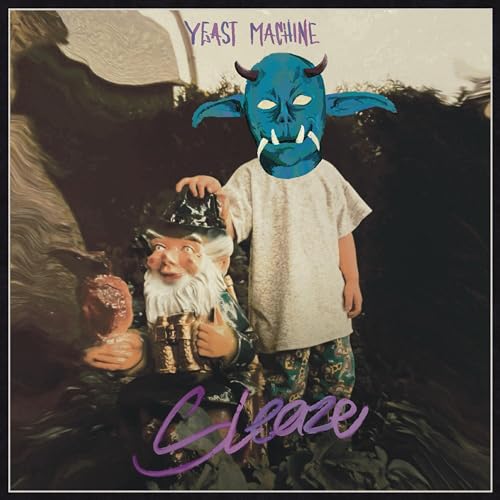 A child with a blue demon mask stands next to a garden gnome.