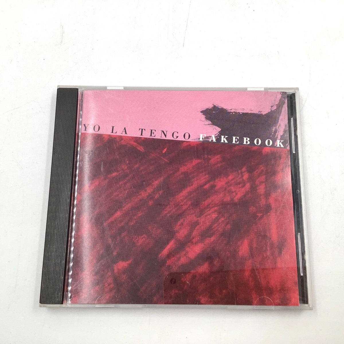 Yo La Tengo "Fakebook" CD with a textured, reddish-purple cover.