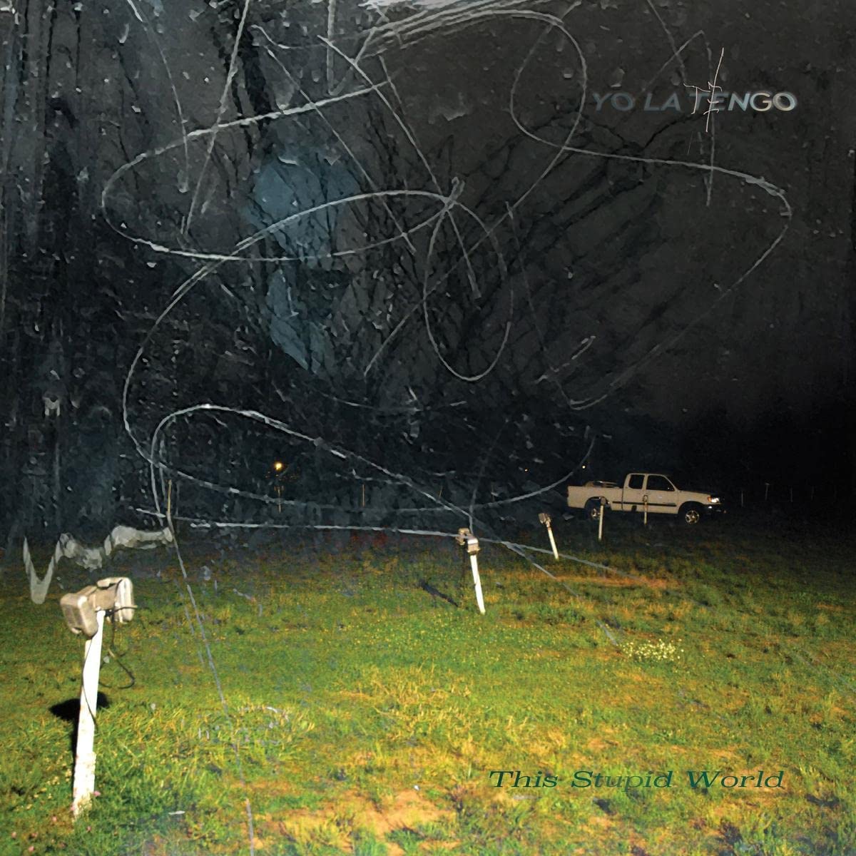 Yo La Tengo album cover: a dark, grassy field with scribbled light streaks.