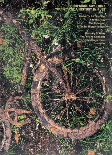 Vinyl album cover with a rusted bicycle wheel and green splatter paint.
