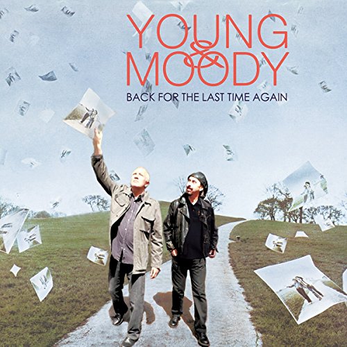 CD cover: two men walking on a road with falling photos.