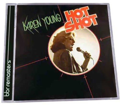 "Karen Young album cover with a black background, singer, and microphone."