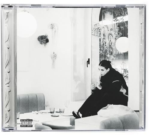Black and white CD case featuring Young Miko sitting in a room.
