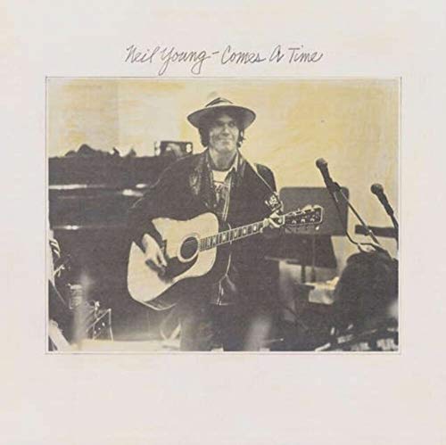 Neil Young album cover: sepia-toned photo of a man with a guitar.