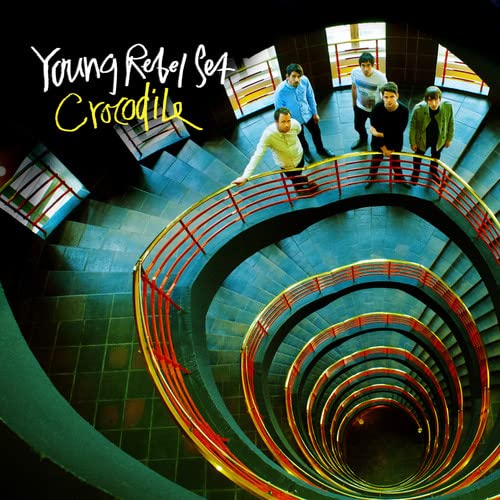 CD cover: four people on a spiral staircase, viewed from above.
