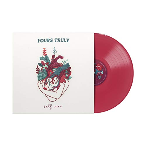 Red vinyl record and cover with floral heart illustration.