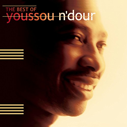 Close-up portrait of Youssou N'dour on a CD cover, warm tones.