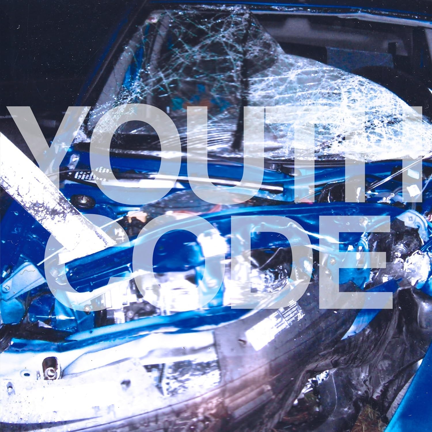 Album cover for Youth Code, featuring a shattered car windshield.