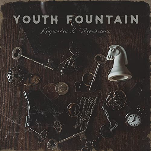 CD cover with vintage keys, chess piece, and clock on wood.