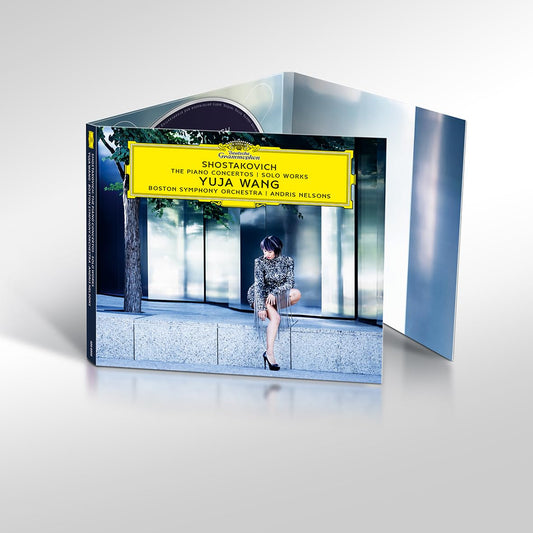 CD case featuring pianist Yuja Wang seated at a grand piano.