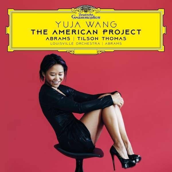 CD cover featuring pianist Yuja Wang in a black dress, smiling.