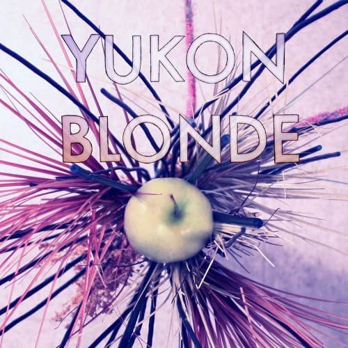 Yukon Blonde" album cover with text and a green apple in pink foliage.