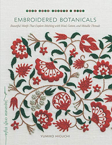 Book cover featuring red and green botanical embroidery on a white linen background.