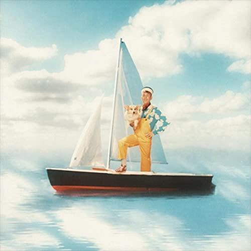 Man with a dog on a sailboat against a blue sky.