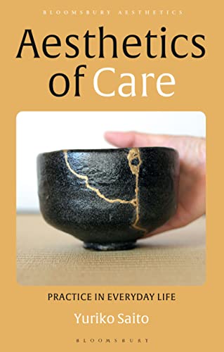Book cover featuring a hand holding a black bowl repaired with gold kintsugi.