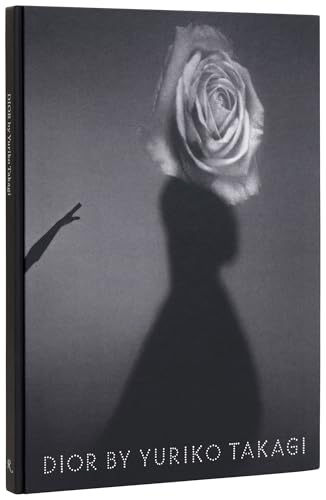 Book cover: grayscale image of a rose over a shadowed figure.