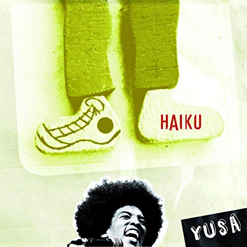 A CD cover featuring a man with an afro and the word "Haiku" in red.