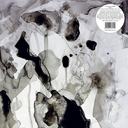 Abstract black ink washes on a white background with a circular information sticker.