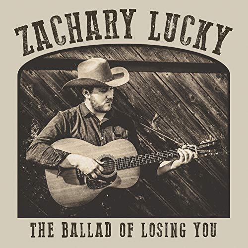 Zachary Lucky album cover: man with guitar in front of wood wall.