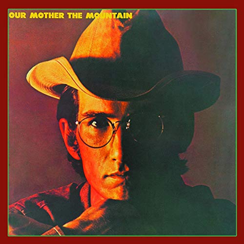 Album cover: close-up of a person wearing a cowboy hat and glasses.