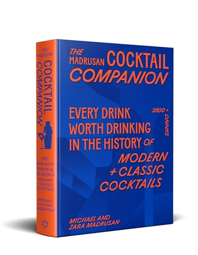 A blue and orange book titled The Madrusan Cocktail Companion standing upright.