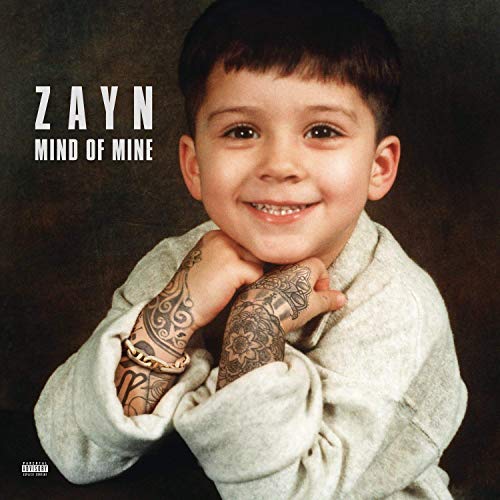 Album cover featuring a young boy with tattooed arms against a dark background.