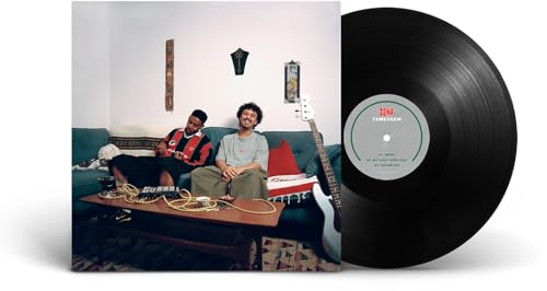 Album cover showing two men on a couch next to a black vinyl record.