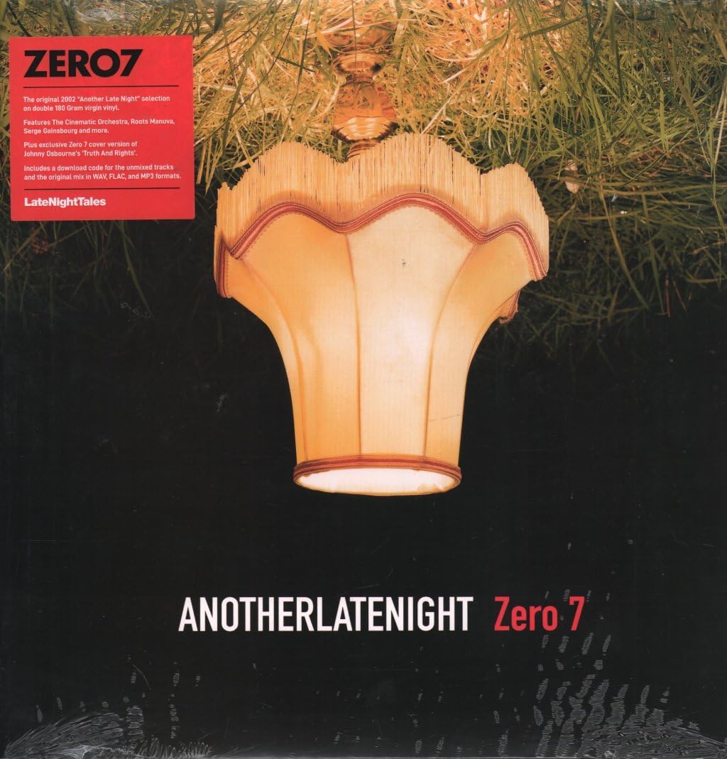 A lit fringed lampshade hangs against a dark background with text at the bottom.