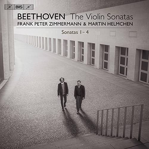 CD cover: two men walking towards the viewer in a courtyard.