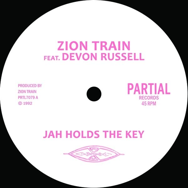 Pink vinyl record label with text: “Zion Train Feat. Devon Russell”.