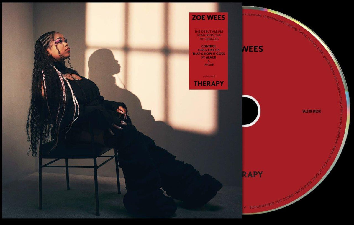 "CD case with red disc and cover featuring a woman sitting in a chair."