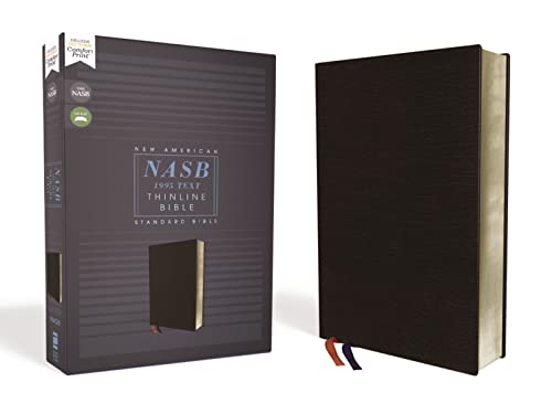 Black bonded leather Bible with red ribbon markers, closed and open.