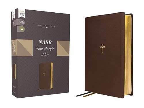 Brown leathersoft Bible with wide margins and a cross emblem.