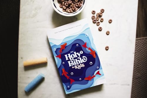 Blue children’s Bible with fish illustrations, alongside cereal and art supplies.