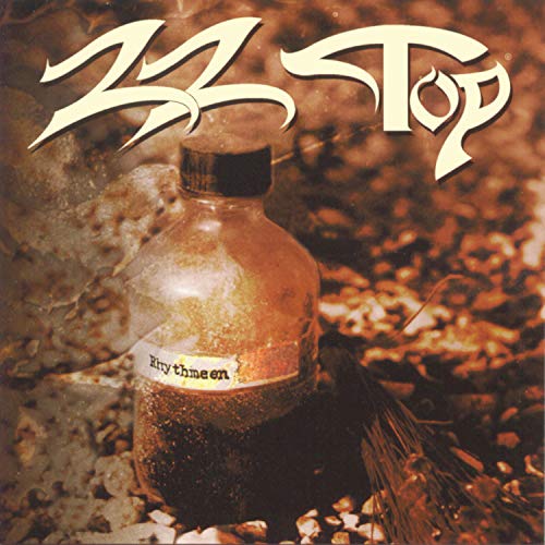 Zz Top “Rhythmeen” album cover: bottle with label, bird, and foliage.