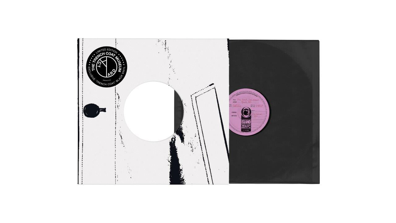 "Black vinyl record with pink label in a white and black sleeve."
