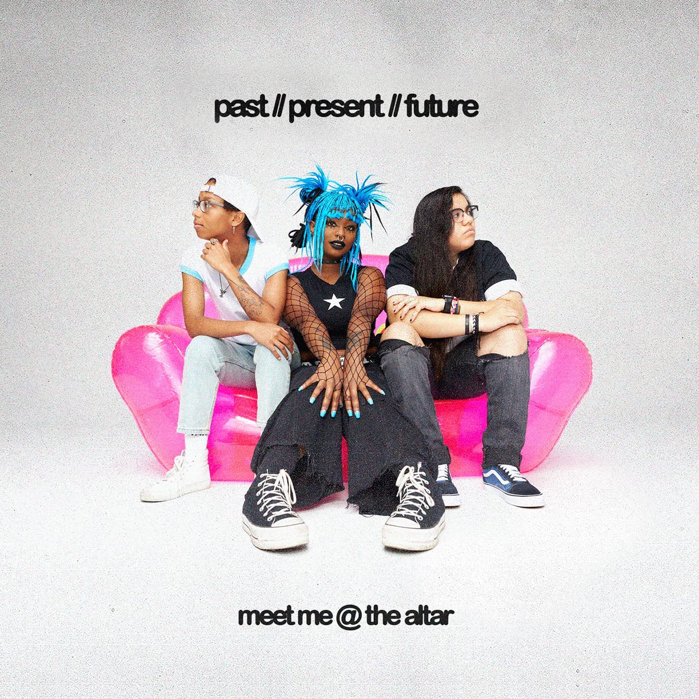 "CD cover art: three young women sitting on a pink couch."