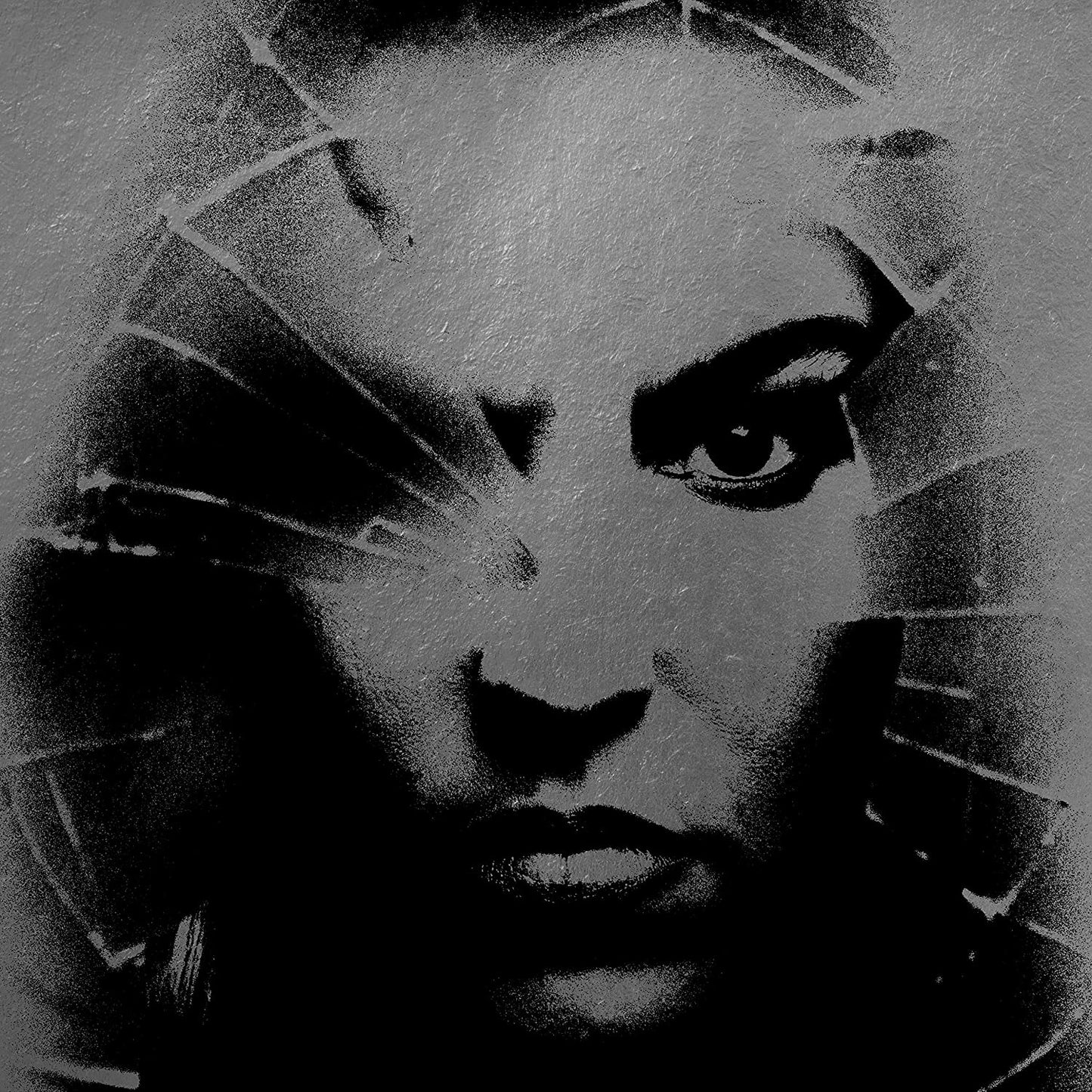 "Black and white close-up of a woman's face with cracked glass effect."
